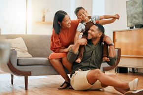 Corona townhouse for rent - A family of three is having fun in their living room.