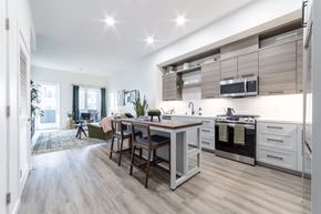 Sacramento apartment for rent - A modern kitchen with a dining table and chairs.