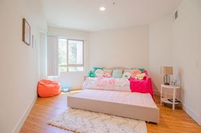 Van Nuys apartment for rent - A bedroom with a large bed and a pink blanket at Woodley Sara Apartment, Van Nuys, CA, 91406