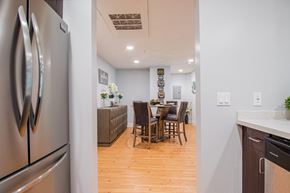Van Nuys apartment for rent - A kitchen with a table and chairs in the middle of the room at Woodley Sara Apartment, Van Nuys, 91406