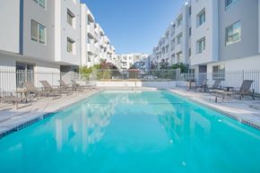 Van Nuys apartment for rent - A swimming pool in front of apartment buildings at Woodley Sara Apartment, Van Nuys, CA, 91406