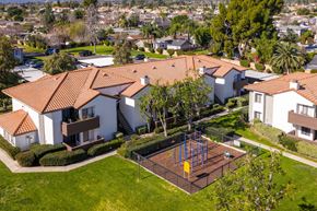 Alta Loma apartment for rent - Aerial view of residential buildings with playground at Woodbend Apartments, Alta Loma, California