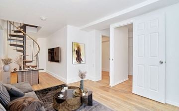 New York apartment for rent - A living room with a grey couch and a coffee table.