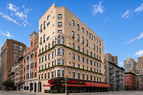 New York apartment for rent - A tall building with a red awning that says "Hell's Kitchen".