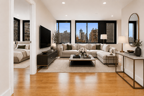 New York apartment for rent - A modern living room with a large window and a view of the city.