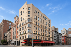 New York apartment for rent - A tall building with a red awning in front of it.