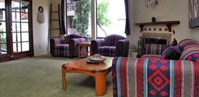 Tucson apartment for rent - A living room with a fireplace and a couch.
