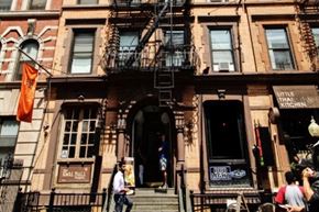 New York apartment for rent - A brown building with a black fire escape.