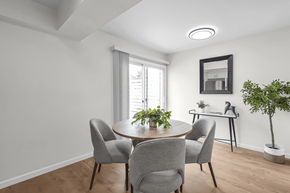 Columbus townhouse for rent - A dining room with a round table and grey chairs.