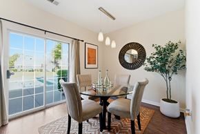 Jonesboro townhouse for rent - A dining room with a glass table and chairs.