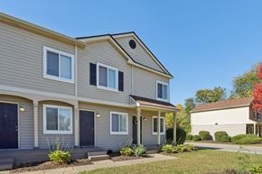 Indianapolis townhouse for rent - A two-story house with a grey and beige exterior.