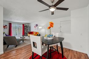 Pontiac apartment for rent - A dining room with a table set for two and a ceiling fan.