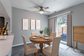Columbus townhouse for rent - A dining room with a table set for two and a ceiling fan.