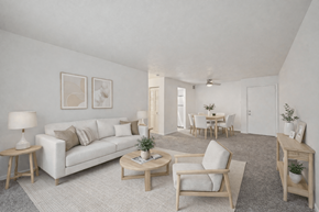 Lancaster townhouse for rent - A living room with a white couch, two chairs, and a coffee table.