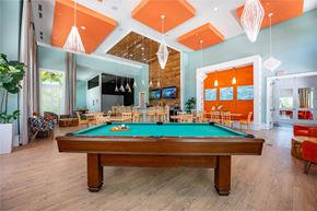 Venice apartment for rent - a pool table in the lobby of a house with a dining room
