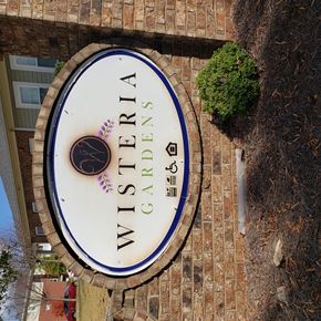Newnan apartment for rent - a clock on the side of a building