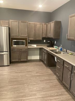 Atlanta apartment for rent - A kitchen with wooden cabinets and a stainless steel refrigerator.