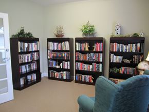 Cartersville apartment for rent - Four bookshelves filled with books and decorative items.