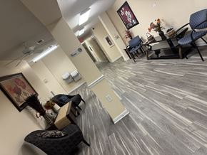 Jacksonville apartment for rent - A room with a grey floor and a ceiling fan.