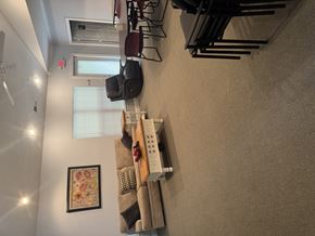 Jacksonville apartment for rent - A wall with a picture and a shelf with objects on it.