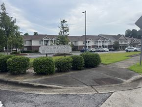 Jacksonville apartment for rent - A street view of a residential area with a sign that reads "LONGBOURNE APARTMENTS".
