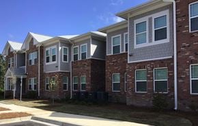 Hartsville apartment for rent - A row of houses with brick and siding exteriors.