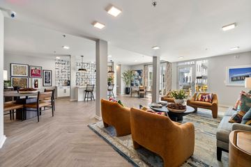 Atlanta apartment for rent - A living room with a couch, chairs, and a coffee table.