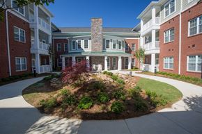 Gainsville apartment for rent - A courtyard surrounded by red brick buildings.