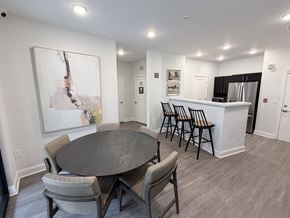 Atlanta apartment for rent - A dining room with a large table and chairs.