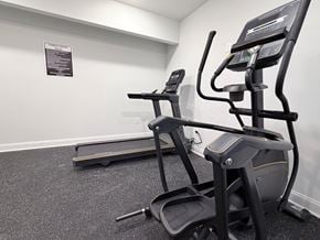 Atlanta apartment for rent - A gym with a treadmill and a stationary bike.