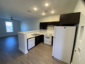 Atlanta apartment for rent - A kitchen with white appliances and a white refrigerator.