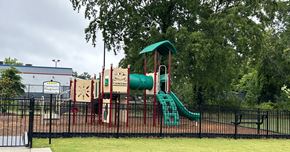 Camden apartment for rent - A playground with a green slide and a red and white structure.