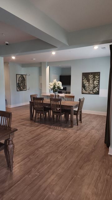 Aiken apartment for rent - A dining room with a wooden table and chairs.
