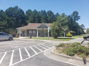 Jacksonville apartment for rent - A small building with a parking lot in front of it.