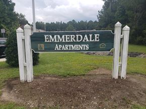 Jacksonville apartment for rent - A sign for Emmerdale Apartments is displayed in front of a grassy area.