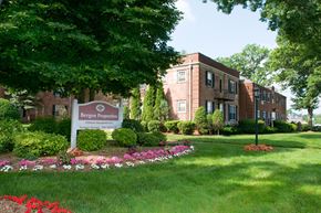 Fair Lawn apartment for rent - Bergen Properties sign in front of a building.