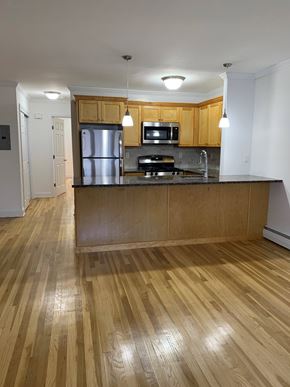 Caldwell apartment for rent - A kitchen with wooden floors and cabinets.