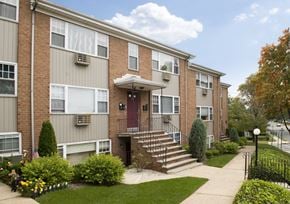 Ridgefield Park apartment for rent - Apartment building with a red door and a small front yard.