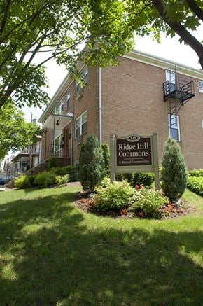 Ridgefield Park apartment for rent - A sign for Ridge Hill Commons is in front of a brick building.