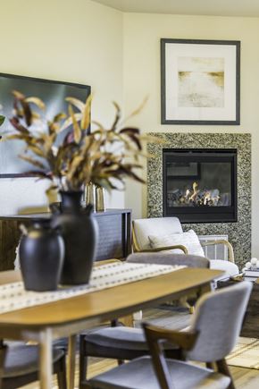 Salinas apartment for rent - A dining room with a fireplace and a painting on the wall.