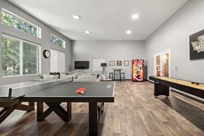 Auburn apartment for rent - a games room with a ping pong table and a foosball table at Mill Pond Apartments, Washington