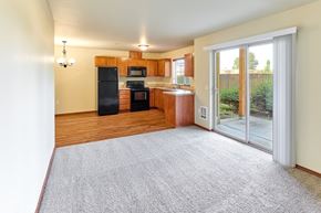 Salem apartment for rent - Living and dining area with patio access at Monroe Avenue Apartments, Salem, Oregon
