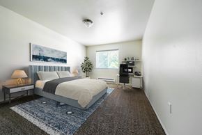 Auburn apartment for rent - a bedroom with a bed and a desk at Mill Pond Apartments, Washington