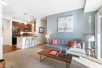 A living room with a couch and a table