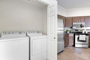 Kitchen with white appliances and stainless steel appliances