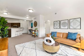 A living room with a couch and a table