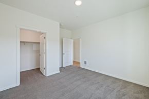 East Wenatchee apartment for rent - a bedroom with white walls and carpet and a door to a closet at Gateway Apartments, East Wenatchee , WA