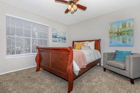Huntsville apartment for rent - a bedroom with a bed and a ceiling fan at The Davis Apartments, Alabama, 35816