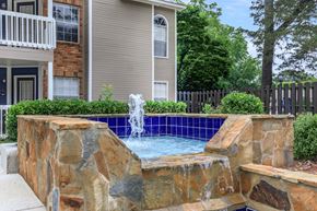 Huntsville apartment for rent - a pool with a fountain in front of a house at The Davis Apartments, Alabama  