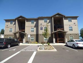 Salem apartment for rent - Three story apartment building with covered entryways and parking at Waln Creek Apartments, Oregon